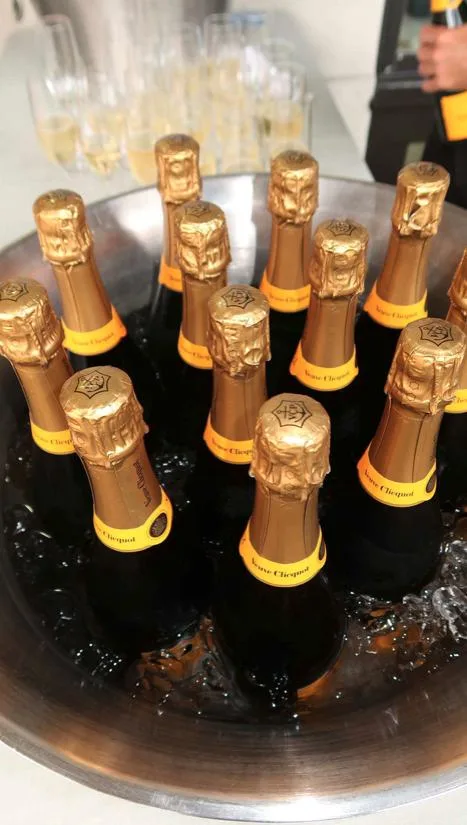 Veuve Clicquot champagne bottles chilling on ice at the Aesthetic Clinique open house